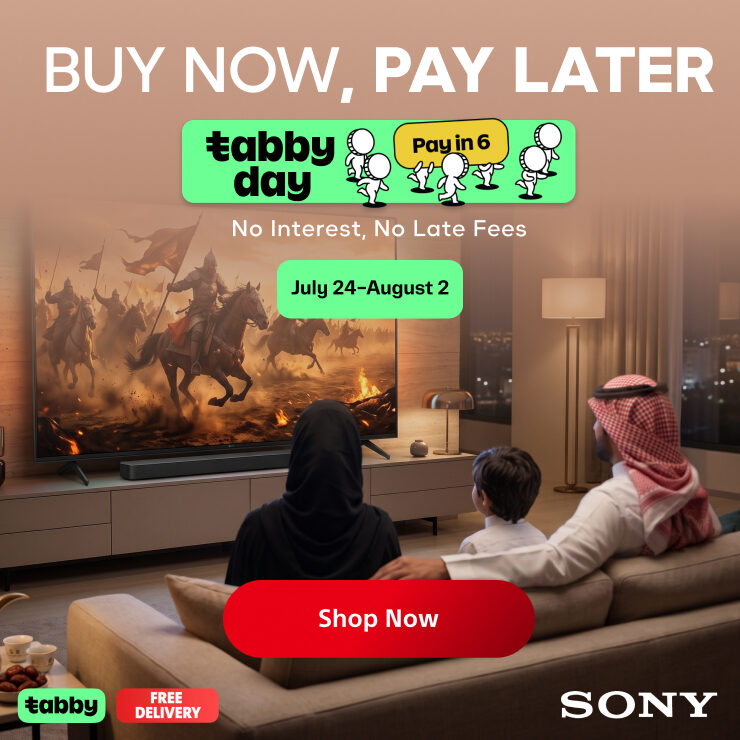 Promotional ad showing a family sitting on a sofa watching a large television in a living room. The TV displays a battle scene.